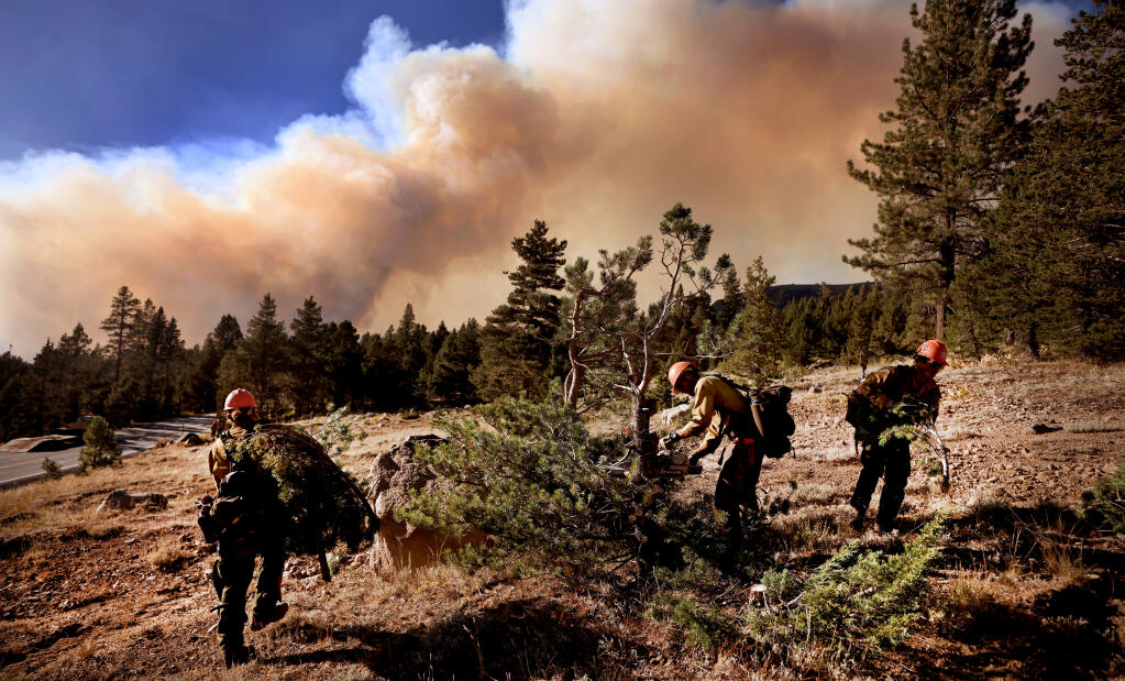 As the Caldor fire threatens Kirkwood Mountain Resort and Carson Pass, Wednesday, Sept. 1, 2021, the Roosevelt Hot Shots, of Fort Collins, Colorado, add to a five blade wide fire break by eliminating fuel. (Kent Porter / The Press Democrat) 2021
