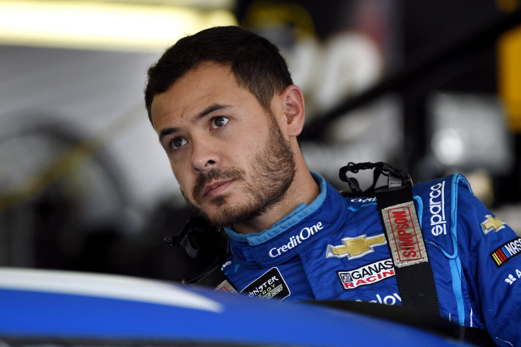In this July 27, 2019, file photo, Kyle Larson climbs into his car for a practice session for the NASCAR Cup Series race in Long Pond, Pennsylvania. (Derik Hamilton / ASSOCIATED PRESS)