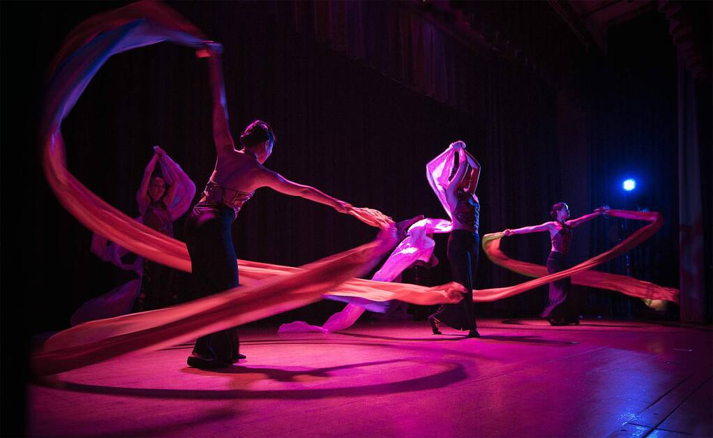 Luminescent dancers wowed the audience at the Veterans Memorial Hall on Saturday at the La Luz 'Noche of China Moon' fundraiser.