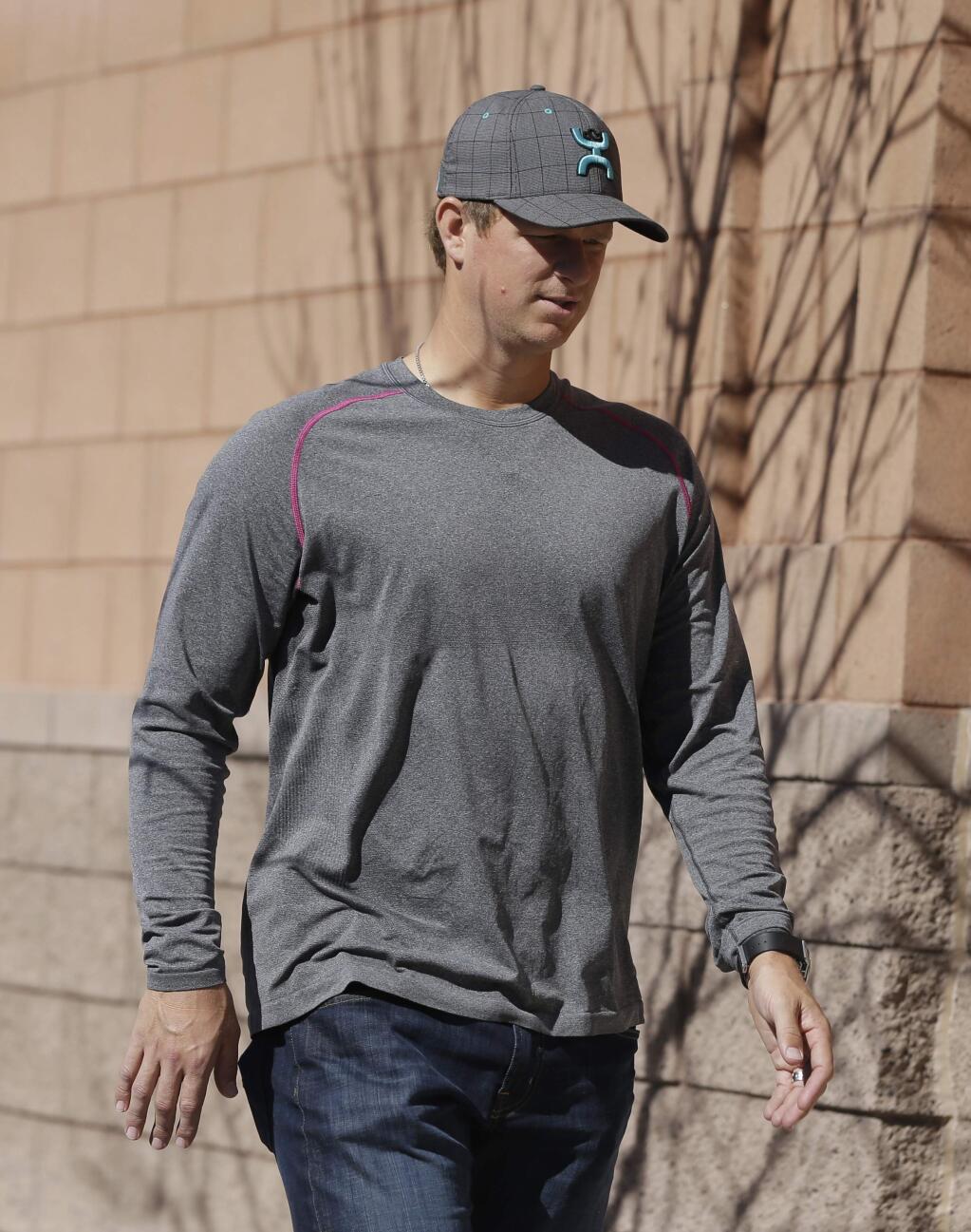 San Francisco Giants' Matt Cain arrives for spring training baseball workouts Wednesday, Feb. 18, 2015, in Scottsdale, Ariz. Giants pitchers and catchers have their first official workout scheduled for Thursday. (AP Photo/Darron Cummings)
