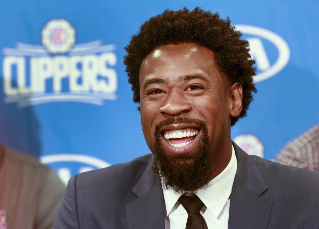 Los Angeles Clippers DeAndre Jordan, the league rebounding champion, is reintroduced by the team at a news conference at Staples Center in Los Angeles on Tuesday, July 21, 2015. The Clippers managed to keep Jordan after he changed his mind about his verbal commitment to Dallas. Jordan thought the Dallas Mavericks offered everything he wanted, including a fresh start and a bigger offensive role. When Jordan thought about it a little more, the craziest free-agent recruitment story in recent NBA history ended with him back on the Los Angeles Clippers. (AP Photo/Nick Ut)