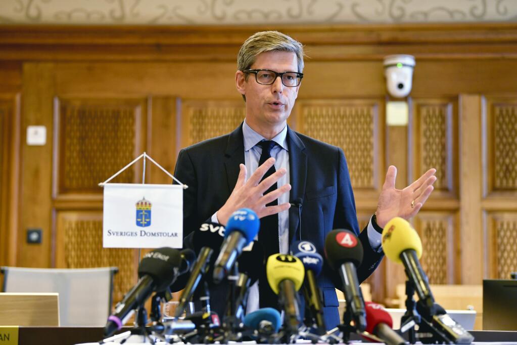 Judge Per Lennerbrant faces the media commenting on the court verdict on American rapper A$AP Rocky and two others, at Stockholm District Court, in Stockholm, Sweden, Wednesday Aug. 14, 2019. Swedish court on Wednesday found American rapper A$AP Rocky guilty of assault for his role in a June 30 street brawl in Stockholm. (Anders Wiklund / TT via AP)