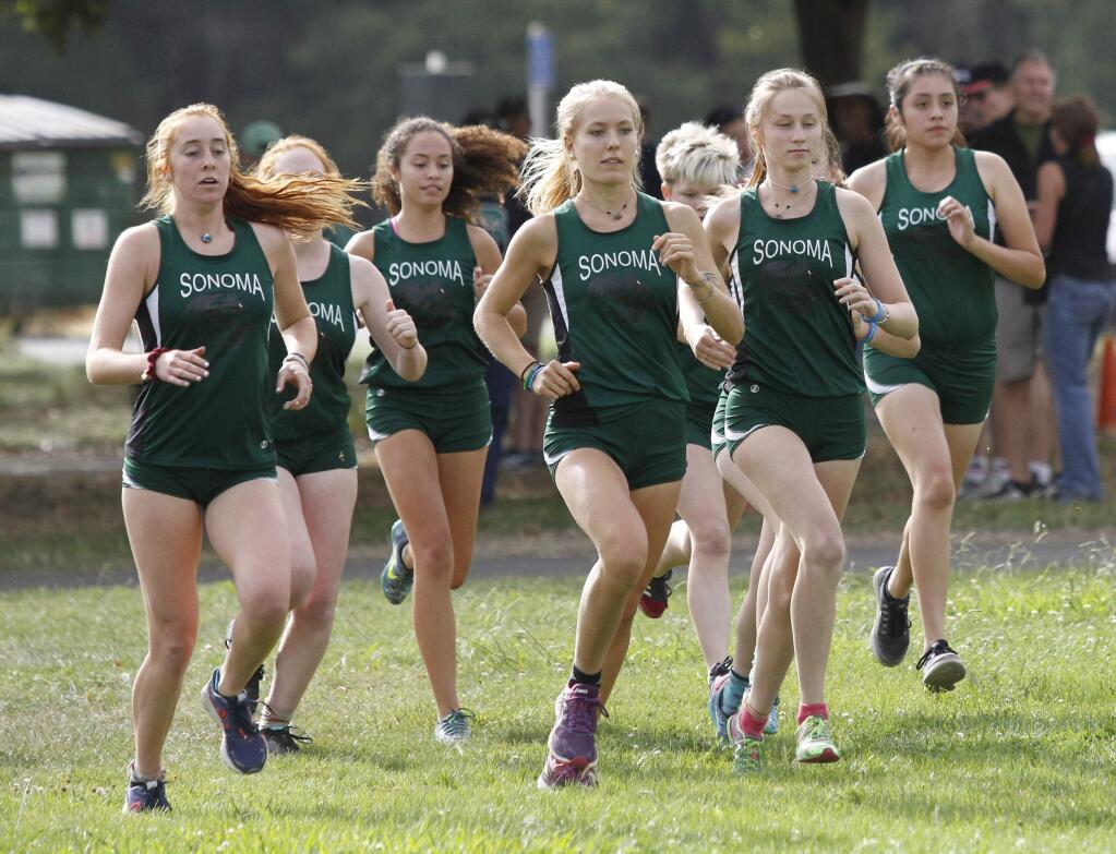 The Lady Dragon track team takes off from the starting line at Wednesday's triangular meet with Pataluma and Rancho Cotate. The Lady Dragons swept the meet, taking four of the top five slots. Amy Stanfield, left, was the overall winner. (Bill Hoban/Index-Tribune)