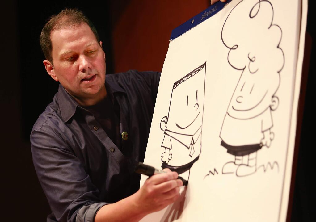 Author/illustrator Dav Pilkey draws George Beard and Harold Hutchins, the two fourth graders in his 'Captain Underpants' series, during a talk and book signing at the Charles M. Schulz Museum in Santa Rosa on Sept. 6, 2014.