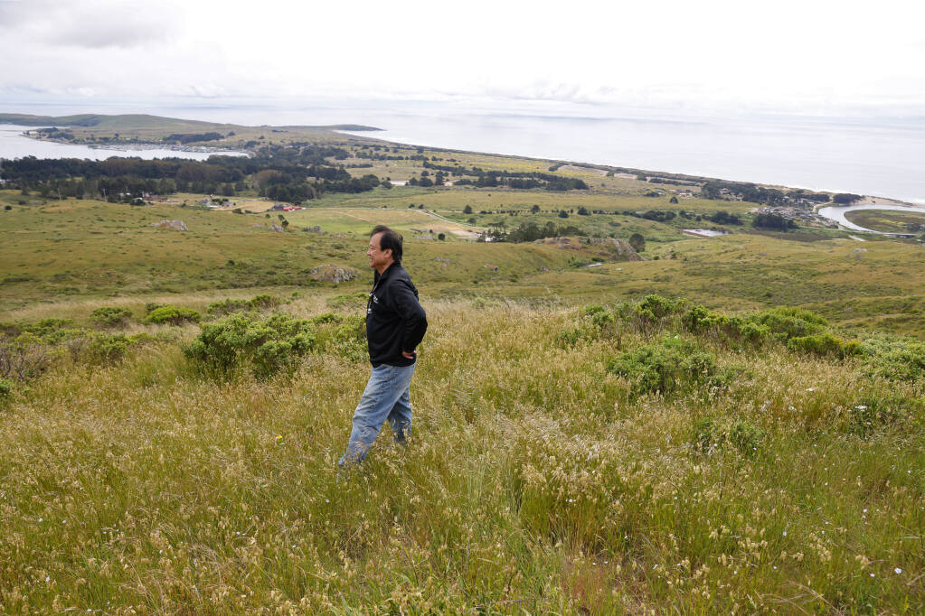 Jonathan Wang, owner of Chanslor Ranch, takes in the view overlooking the coast from his property in Bodega Bay on Friday, May 26, 2023. Sonoma County Ag + Open Space is in contract to purchase the 378-acre Chanslor Ranch property for transfer to the Sonoma County Regional Park system. (Christopher Chung/The Press Democrat)