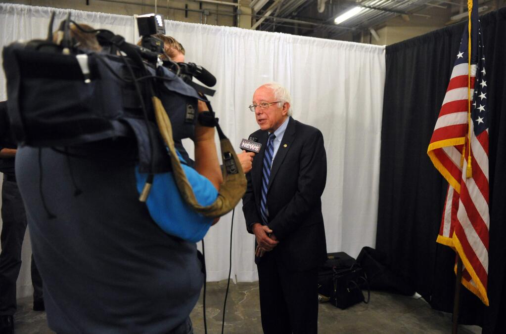 Democratic presidential hopeful Bernie Sanders speaks to members of the media before the start of a rally at the Old National Events Plaza during a rally in Evansville, Ind., Monday, May 2, 2016. Indiana holds its primary Tuesday. (Jason Clark/Evansville Courier & Press via AP) MANDATORY CREDIT