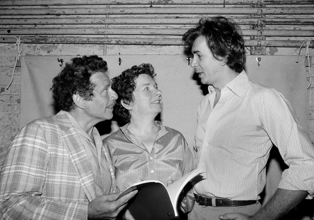 FILE- In this Aug. 18, 1980, file photo, actor Frank Langella, right, talks with Jerry Stiller, left, and Angela Paton at the Morosco Theater in New York. Paton, best known for appearing with Bill Murray in Groundhog Day, has died at age 86. Her nephew George Woolf says Paton died Thursday, May 26, 2016. (AP Photo/Marty Lederhandler, File)