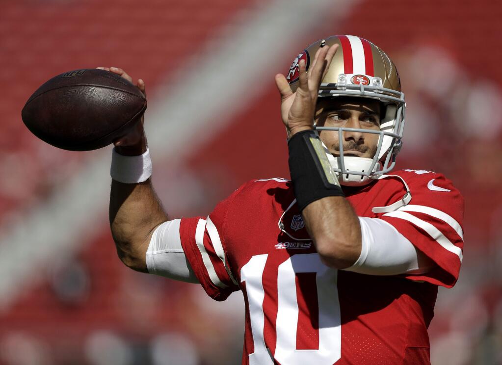In this Nov. 5, 2017, file photo, San Francisco 49ers quarterback Jimmy Garoppolo warms up before a game against the Arizona Cardinals in Santa Clara. The way Garoppolo plays down the stretch once he finally takes over as the starting quarterback for the 49ers will determine how much money he will get paid to be the franchise quarterback in San Francisco. (AP Photo/Marcio Jose Sanchez, File)