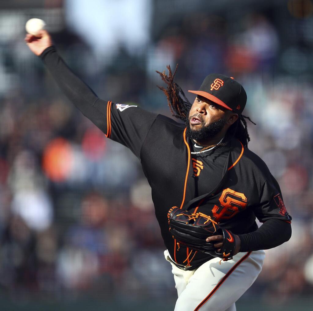 San Francisco Giants pitcher Johnny Cueto works against the Milwaukee Brewers in the first inning Saturday, July 28, 2018, in San Francisco. (AP Photo/Ben Margot)