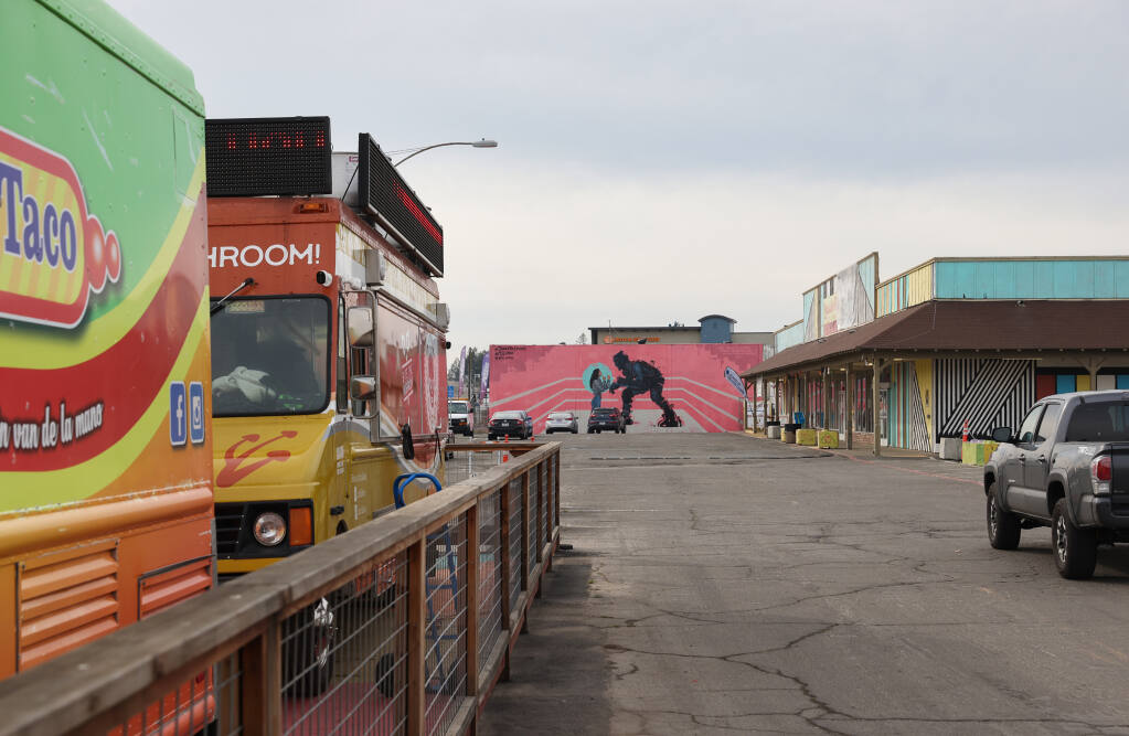 Food trucks and Mercadito Roseland at the site of the future Tierra de Rosas redevelopment project in Santa Rosa, Thursday, Feb. 2, 2023. (Christopher Chung/The Press Democrat)