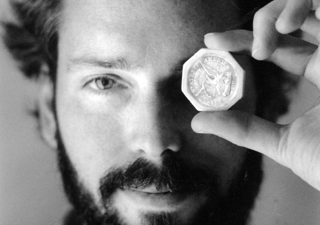 FILE -In this November 1989 file photo, Tommy Thompson holds a $50 pioneer gold piece retrieved earlier in 1989 from the wreck of the gold ship Central America. According to the US Marshals Service, Thompson, a fugitive treasure hunter wanted for more than 2 years was arrested in Florida. (AP Photo/The Columbus Dispatch, Lon Horwedel)