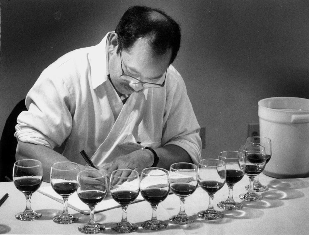 Wilfred Wong scores zinfindel during judging. (The Press Democrat Archives 1991)