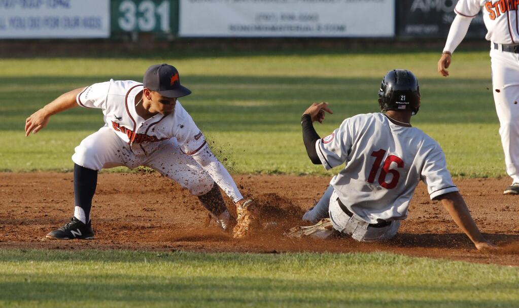 Bill Hoban/Index-TribuneSonoma Stompers Eddie Mora-Loera puts the tag on a Napa runner in a recent game. The Stompers are on the road through Friday when they return home for a fice-game homestand.