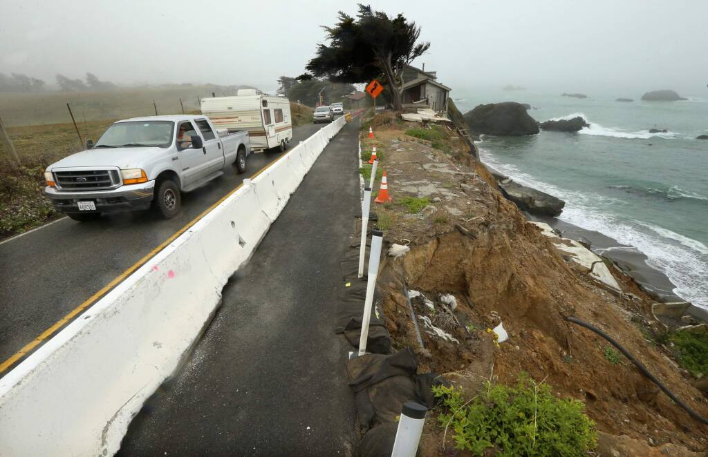 Caltrans was forced to install lights and close off the southbound lane of traffic as the coastline continues to erode at Gleason Beach along Hwy 1 north of Bodega Bay. (JOHN BURGESS/The Press Democrat)