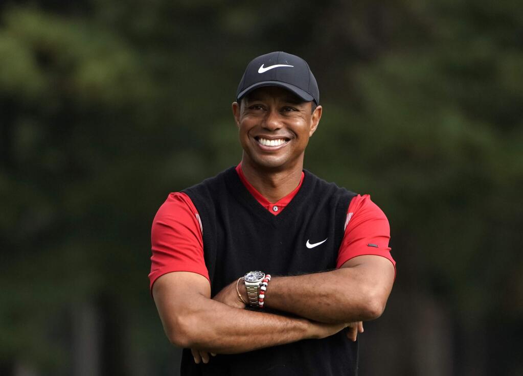 Tiger Woods of the United States smiles during a winner's ceremony after winning the Zozo Championship PGA Tour at the Accordia Golf Narashino country club in Inzai, east of Tokyo, Japan, Monday, Oct. 28, 2019. (AP Photo/Lee Jin-man)