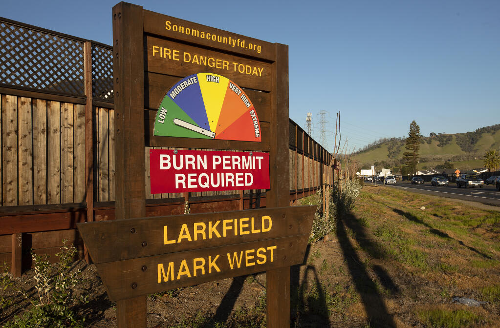 A sign alerting residents to the level of fire danger at the corner of Mark West Springs Road and Old Redwood Highway, Monday, Feb. 7, 2022. (John Burgess/The Press Democrat file)