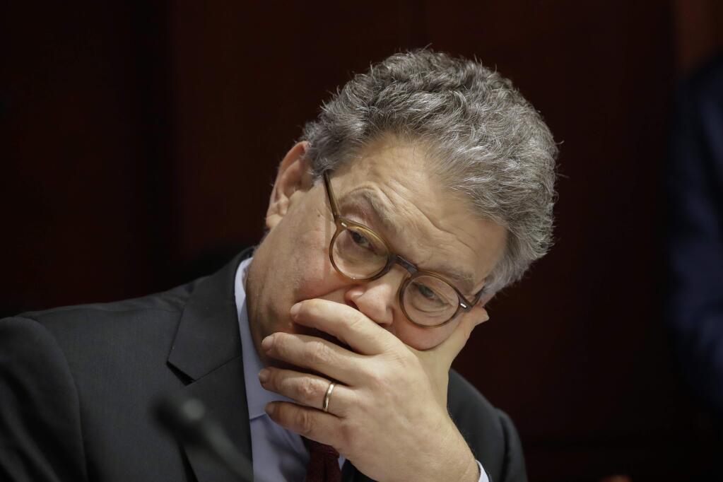FILE - In this June 21, 2017 file photo, Sen. Al Franken, D-Minn., listens at a committee hearing at the Capitol in Washington. A second woman has accused Minnesota Sen. Al Franken of inappropriate touching, saying Monday, Nov. 20, 2017 that he put his hand on her bottom as they posed for a picture at the Minnesota State Fair in 2010, after he had begun his career in the Senate. Menz's allegation comes days after a Los Angeles broadcaster, Leeann Tweeden, accused Franken of forcibly kissing her during a 2006 USO tour. (AP Photo/J. Scott Applewhite File)