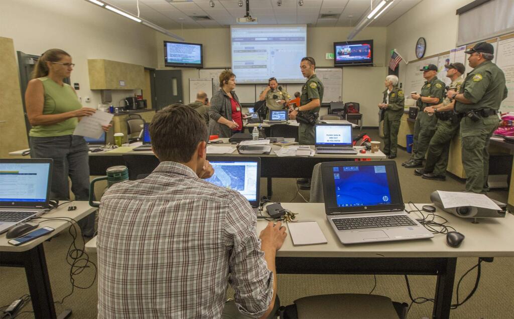 Police and fire representatives attend a meeting in the Emergency Operations Center behind the Sonoma Police Station on Oct. 11, 2017. (Bill Hoban/Index-Tribune)