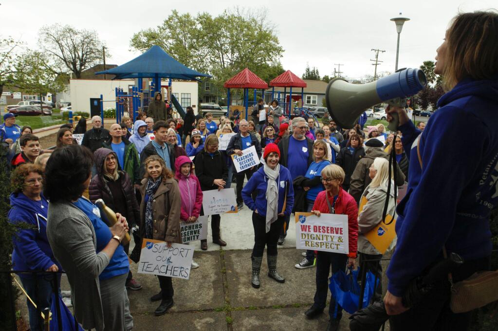 Petaluma, CA. Tuesday, April 11, 2017._ Suzanne Garcia, PFT Chief Negotiator and second grade teacher at McNear Elementary speaks to teachers and their supporters at Walnut Park where they met before marching to the district office to demand better pay.(CRISSY PASCUAL/ARGUS-COURIER STAFF)