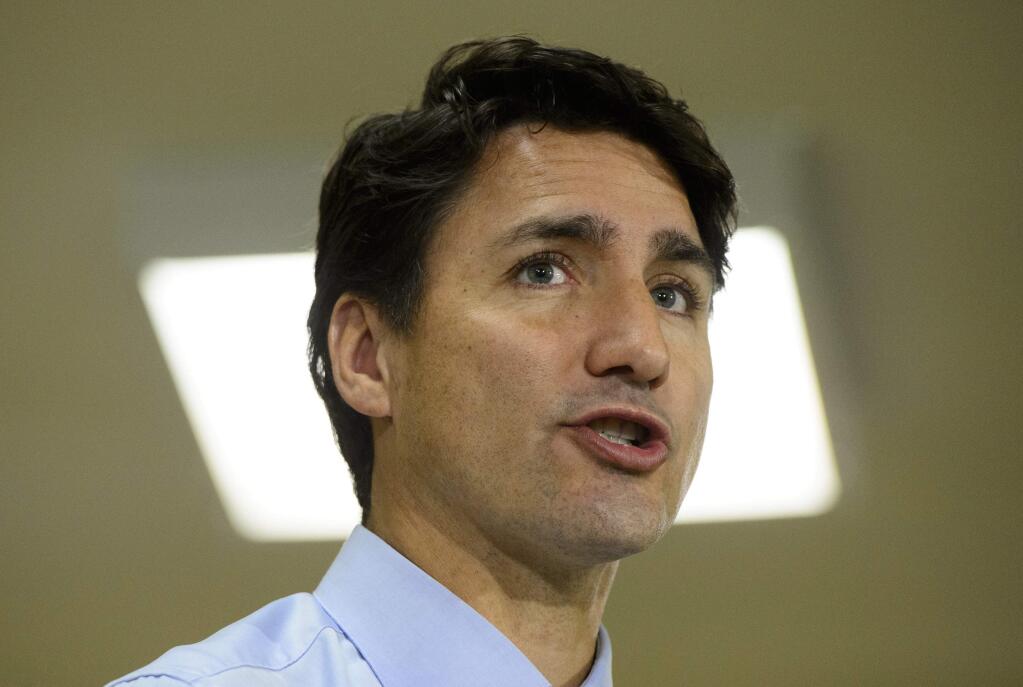 In this Tuesday, Sept. 17, 2019, photo, Canadian Prime Minister and Liberal leader Justin Trudeau makes a campaign stop in St. John's, Newfoundland and Labrador, Canada. Trudeau's campaigning for national elections has been hit by the publication of a yearbook photo showing him in 'brownface' makeup at a costume party in 2001. (Sean Kilpatrick/The Canadian Press via AP)