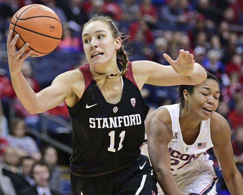 Stanford's Alanna Smith reaches for the ball while being bumped by UConn's Napheesa Collier during the first quarter Sunday, Nov. 12, 2017, in Columbus, Ohio. (AP Photo/David Dermer)