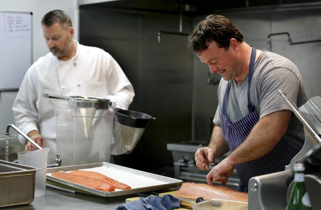 Chef Douglas Keane, right, and sous chef Drew Glassell prep food for an upcoming charity dinner in Dallas at his test kitchen in Healdsburg, California on Tuesday, September 30, 2014. (BETH SCHLANKER/ The Press Democrat)