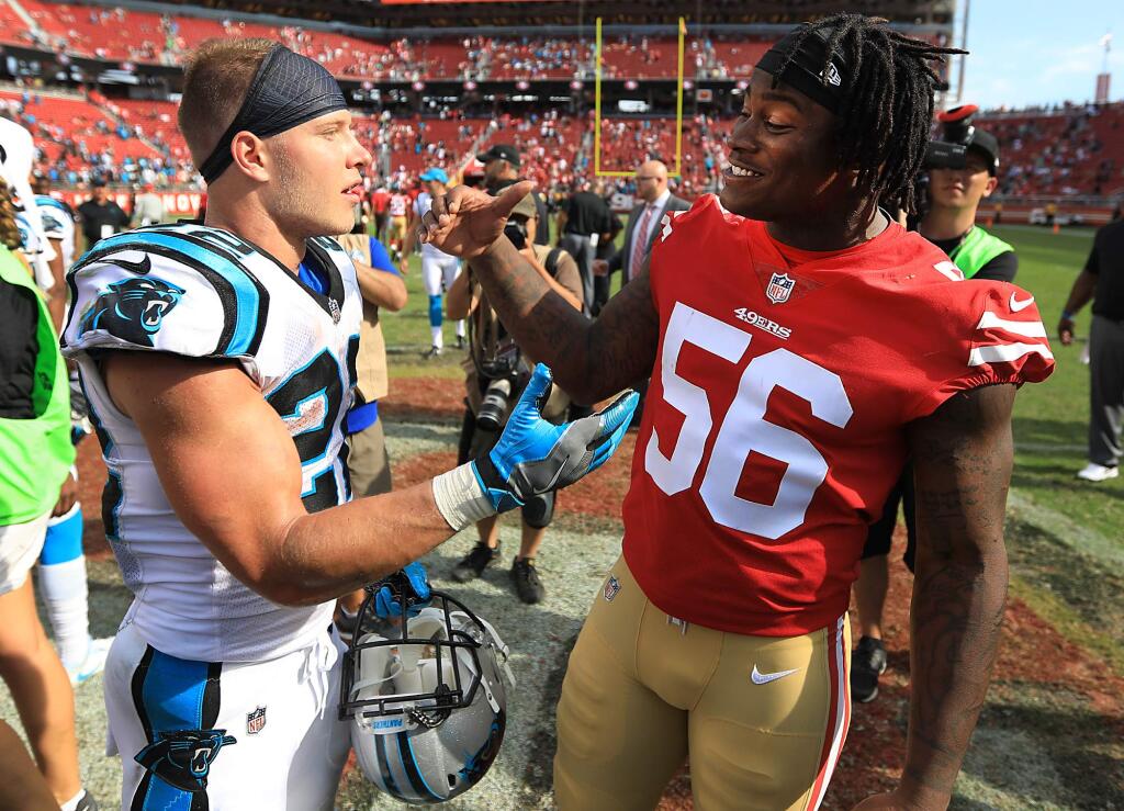 The Panthers' Christian McCaffrey, left and San Francisco's Reuben Foster exchange greetings after the 49ers' 23-3 home opener loss at Levi's Stadium in Santa Clara, Sunday Sept. 10, 2017. (Kent Porter / The Press Democrat)