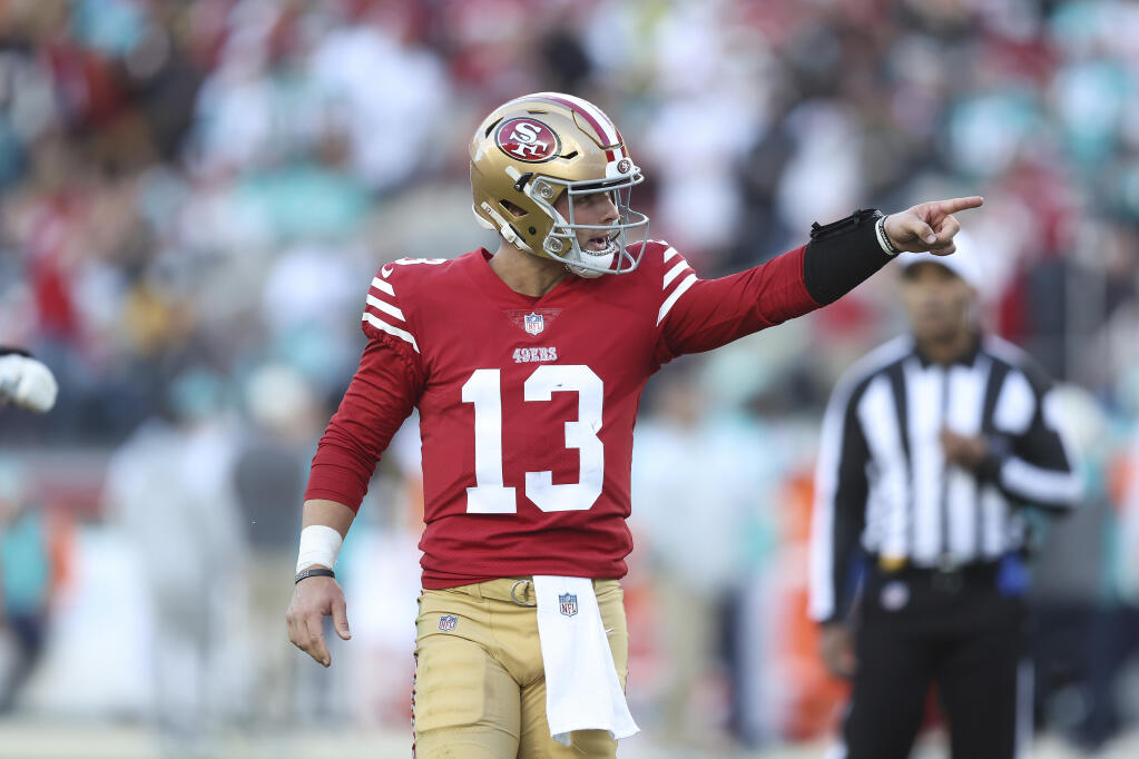 San Francisco 49ers quarterback Brock Purdy (13) celebrates after a touchdown in the third quarter during an NFL football game against the Miami Dolphins, Sunday, Dec. 4, 2022 in Santa Clara, Calif. (AP Photo/Lachlan Cunningham)