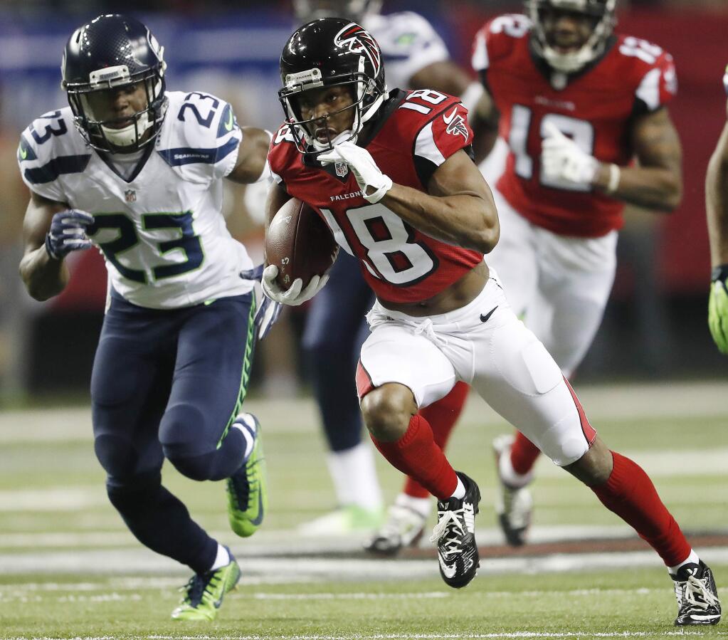Atlanta Falcons wide receiver Taylor Gabriel (18) runs against Seattle Seahawks free safety Steven Terrell (23) during the first half of an NFL football divisional football game, Saturday, Jan. 14, 2017, in Atlanta. (AP Photo/John Bazemore)