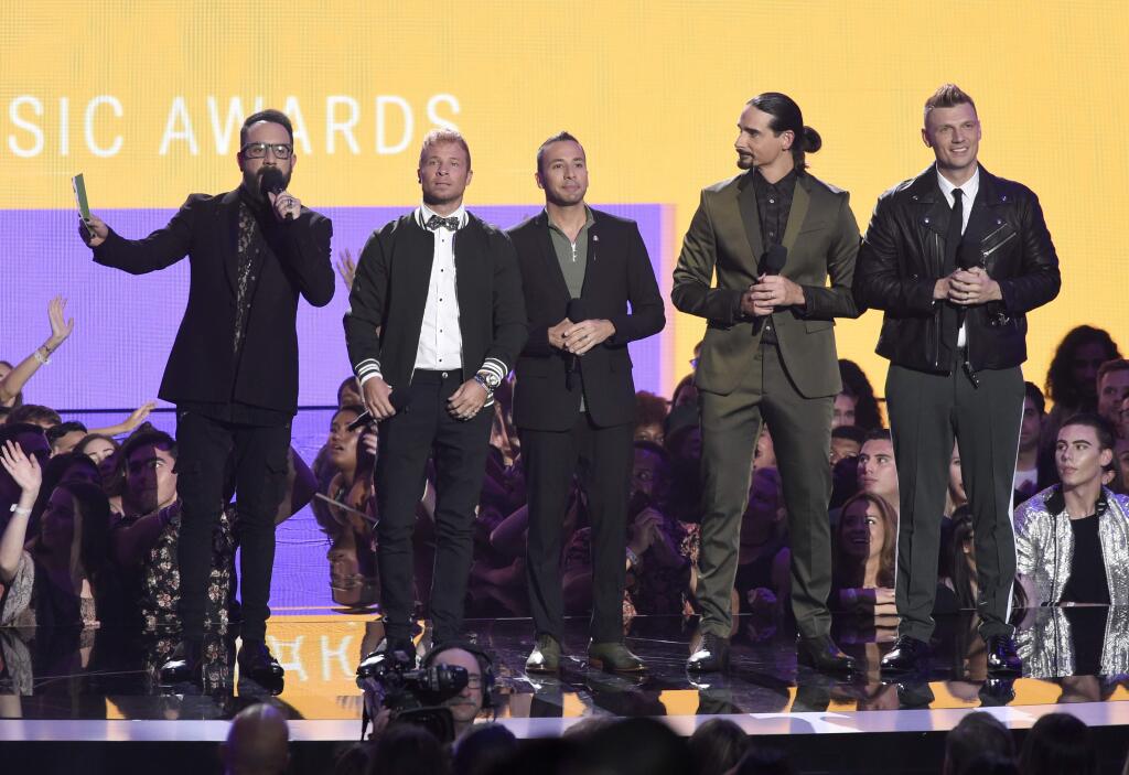 AJ McLean, from left, Brian Littrell, Howie Dorough, Kevin Richardson and Nick Carter of the Backstreet Boys speak at the MTV Video Music Awards at Radio City Music Hall on Monday, Aug. 20, 2018, in New York. (Photo by Chris Pizzello/Invision/AP)