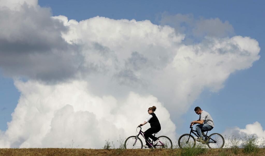 Bicyclists cruise around Spring Lake in this file photo. (Kent Porter / The Press Democrat)