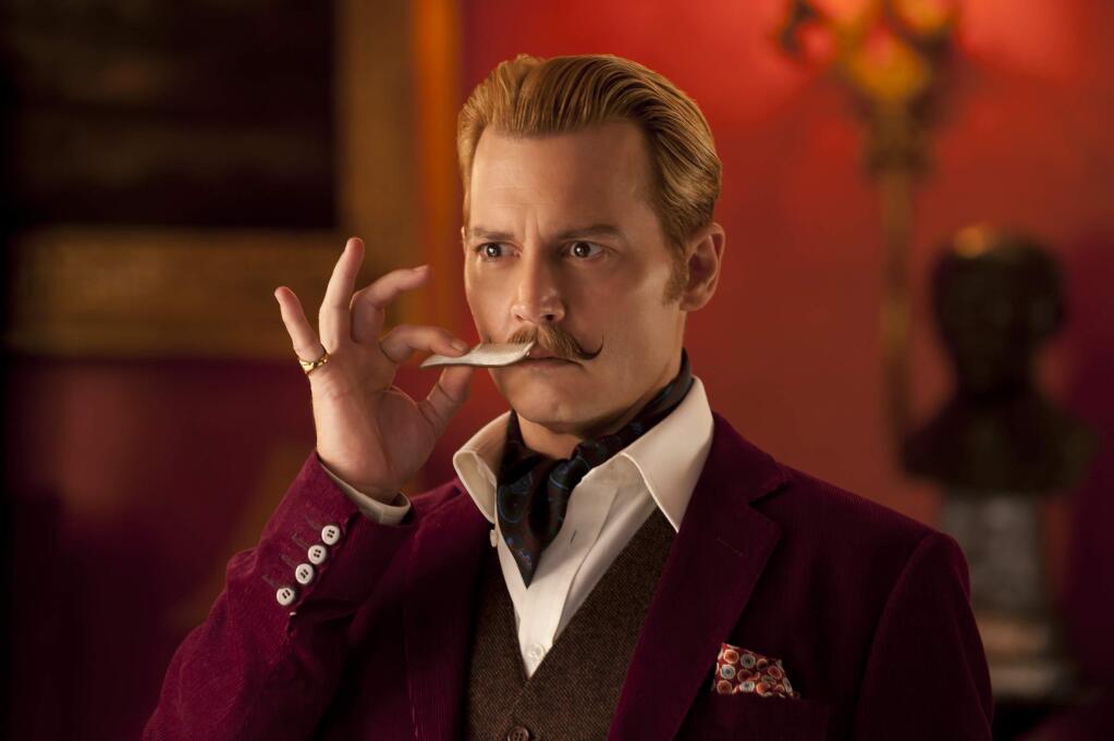 LionsgateJohnny Depp as art dealer Charlie Mortdecai who is in a race to recover a painting rumored to contain the code to a lost bank account filled with Nazi gold in 'Mortdecai.'