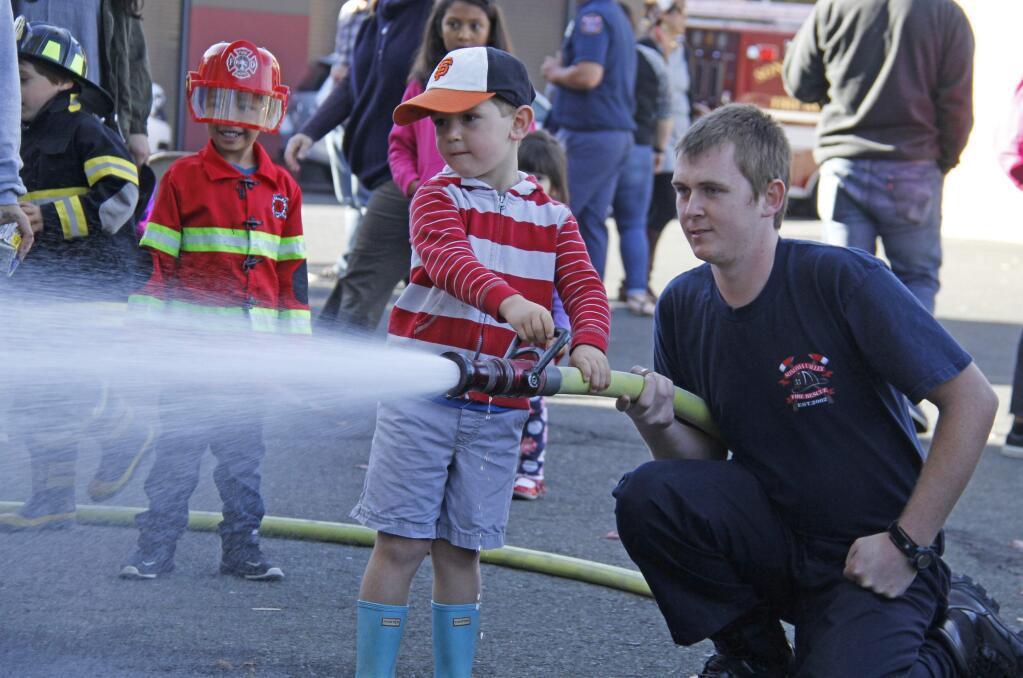 Index-Tribune file photoThis youngster got some instruction on how to put out a fire at last year's open house at the Sonoma Valley Fire and Rescue Authority.