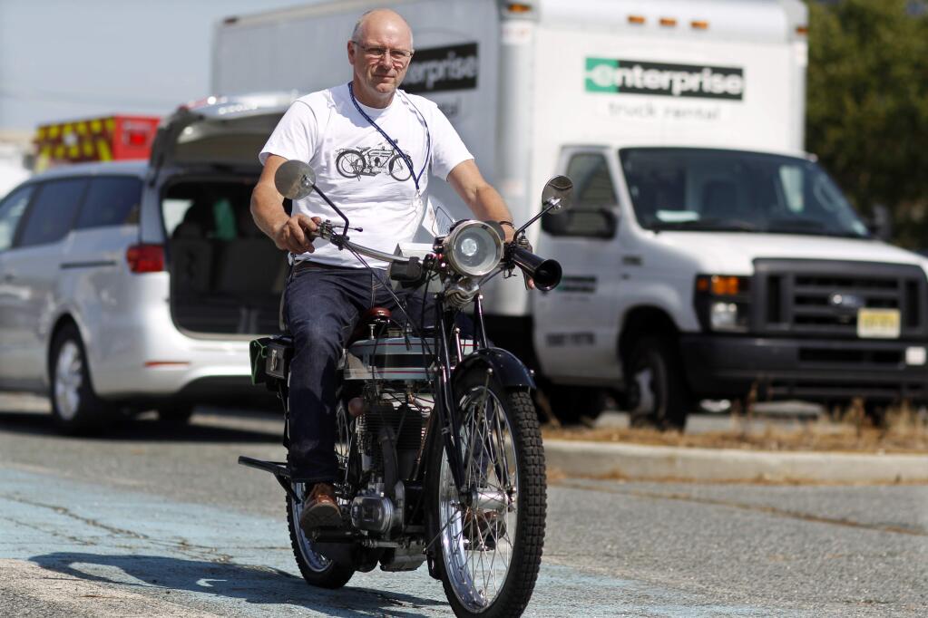 Stu Surr takes a test-ride on his 1916 Triump motorcycle Thursday, Sept. 8, 2016, in Atlantic City, N.J., as he prepares for the Motorcycle Cannonball, a bi-annual run for vintage motorcyclists, that will take them almost 3,400 miles across the country from Atlantic City to San Diego. This marks the fourth race since motorcycle expert Lonnie Isam Jr., founded the inaugural run in 2010, but the first that requires motorcycles at least 100 years in age. (AP Photo/Mel Evans)