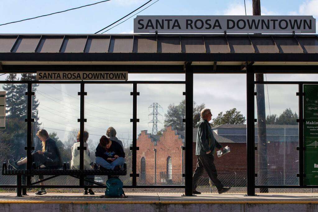 SMART train passengers wait for a southbound train at the Railroad Square station in Santa Rosa, California, on Thursday, February 13, 2020. (Alvin Jornada / The Press Democrat)
