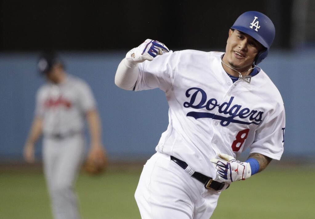 In this Oct. 5, 2018, file photo, then-Los Angeles Dodgers' Manny Machado celebrates his two-run home run against the Atlanta Braves during the first inning of Game 2 of the National League Division Series, in Los Angeles.(AP Photo/Jae C. Hong, File)
