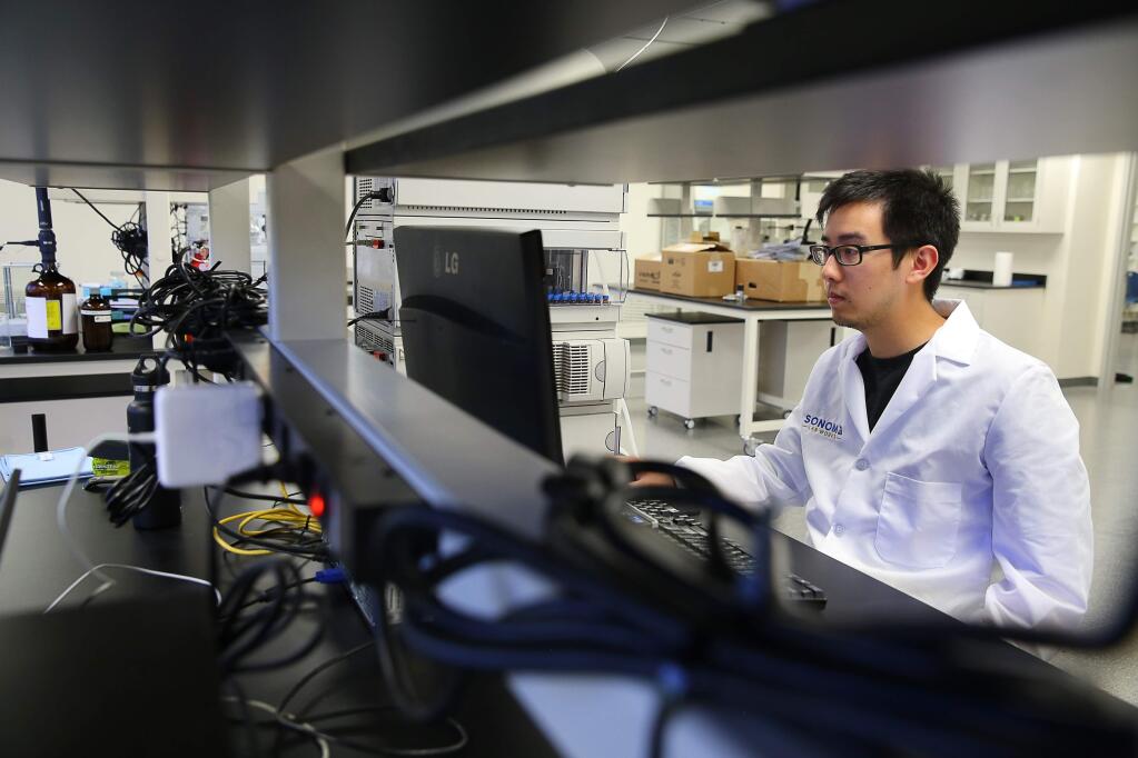 Sonoma Lab Works head analyst David Chen works on calibrating the high pressure liquid chromatography instrument, used in determining the concentration of cannabinoids in cannabis and cannabis products, in Santa Rosa, on Wednesday, July 6, 2016. (Christopher Chung/ The Press Democrat)