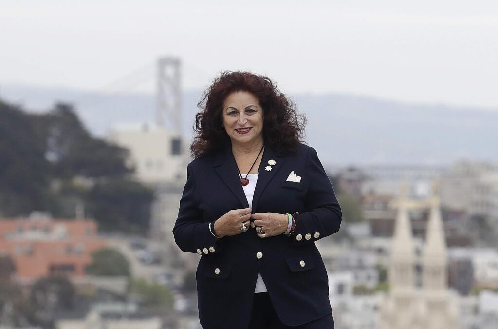 FILE - In this April 5, 2018, file photo, Angela Alioto poses on Russian Hill in San Francisco. San Francisco voters are electing a new mayor in a contest hastily placed on the June 5 ballot after the unexpected death of Mayor Ed Lee in December. San Francisco could make history by electing its first African-American woman, Asian-American woman or openly gay man for mayor. The city has enormous wealth thanks to a flourishing economy led by the tech industry, but it's also plagued by rampant homelessness. This mayor's race is the city's first competitive mayoral race in 15 years. (AP Photo/Jeff Chiu, file)