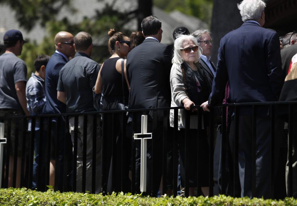 Following the funeral of her son, Josh Clark, Susan Radelt stands outside to talk with those in attendance at Our Lady of Mount Carmel Church in Mill Valley, on Sunday, June 12, 2016. (BETH SCHLANKER/ The Press Democrat)