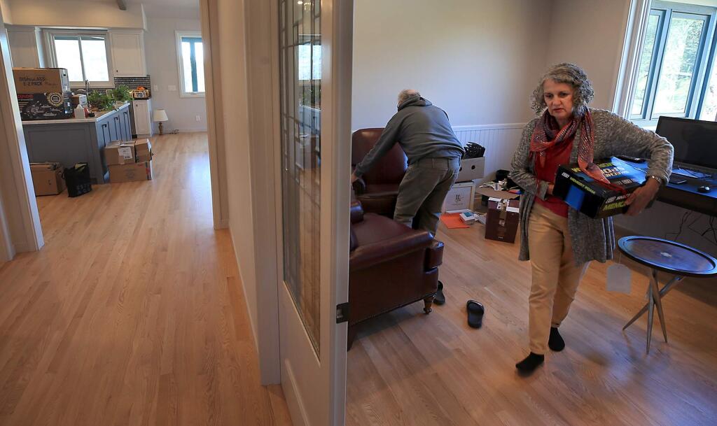Barry and Marlena Hirsch move in to their newly rebuilt home, Wednesday, Oct. 24, 2018 in the Mark West area. Like most of their neighbors, the home was razed in the Tubbs fire. (Kent Porter / The Press Democrat) 2018