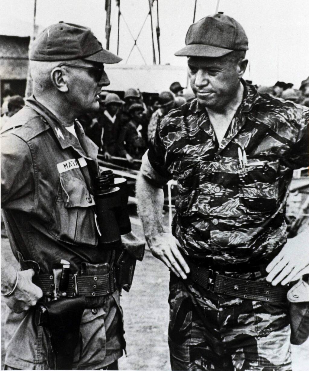 After a week-long siege by Vietcong on a special forces camp in the Vietnam Highlands in 1965, Frank McCulloch, right, talks with the colonel commanding the zone while on assignment for Time-Life.3/9/2003: D6: Following a weeklong siege by Viet Cong on a Special Forces camp in the highlands of Vietnam in 1965, Frank McCulloch, right, talks with a colonel commanding the zone while on assignment for Time magazine.