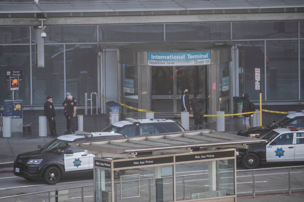 First responders respond to the International Terminal at San Francisco International Airport (SFO) after an incident involving an armed individual in front of the BART station entrance in San Francisco, Calif., Thursday, Jan. 20, 2022. (Stephen Lam/The San Francisco Chronicle via AP)