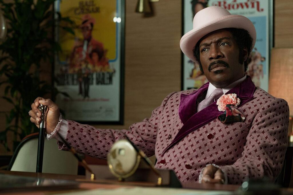 Eddie Murphy in “Dolemite Is My Name' as floundering comedian Rudy Ray Moore who has an epiphany that turns him into a word-of-mouth sensation: step onstage as someone else -- Dolemite, a pimp with a cane and an arsenal of obscene fables. (Francois Duhamel/ Netflix)