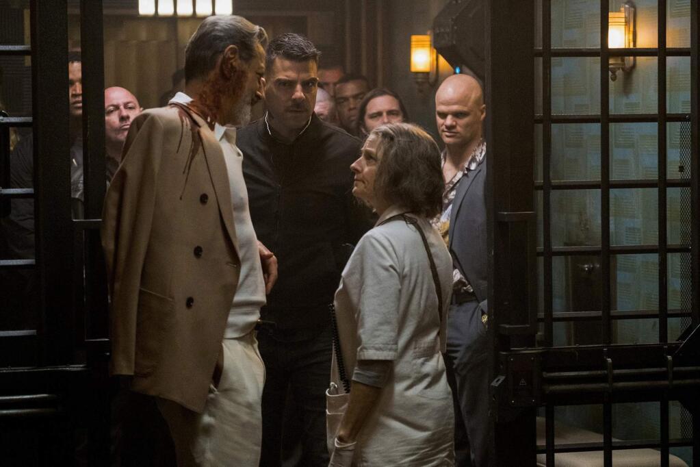 Jody Foster as The Nurse, who runs a secret members-only hospital for criminals, including The Wolf King (Jeff Goldblum, left) in riot-torn, near-future Los Angeles in 'Hotel Artemis.' (Global Road Entertainment)