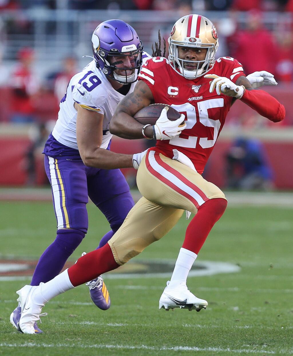 San Francisco 49ers cornerback Richard Sherman runs after intercepting a pass intended for Minnesota Vikings wide receiver Adam Thielen during their NFC divisional playoff game at Levi's Stadium in Santa Clara on Saturday, January 11, 2020. The 49ers defeated the Vikings 27-10.(Christopher Chung/ The Press Democrat)