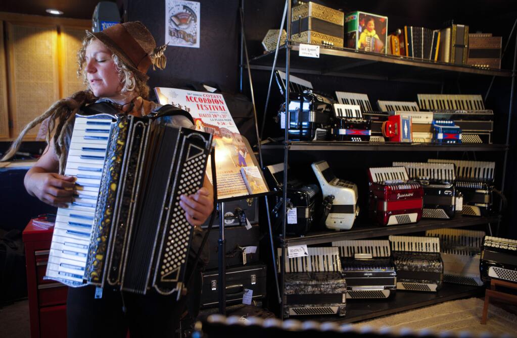 Petaluma, CA, USA. Monday, July 25, 2016._ Skyler Fell opened The Accordion Apocalypse Repair Shop in Petaluma two months ago. She has been repairing accordions since 2002 in San Francisco but says she prefers the serenity and quiet of Petaluma because 'the pace lends itself to better craftsmanship'. She will be performing in the upcoming 26th Annual Cotati Accordion Festival in August. (CRISSY PASCUAL/ARGUS-COURIER STAFF)
