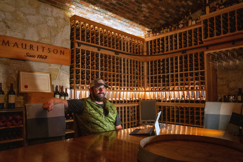Clay Mauritson, co-owner of Mauritson Wines in Healdsburg, California, sits Friday, Aug. 28, 2020, in the winery’s library where VIP tastings are usually held. Because of COVID-19 restrictions, he has been using the room to hold Zoom meetings. (Alvin A.H. Jornada / The Press Democrat)