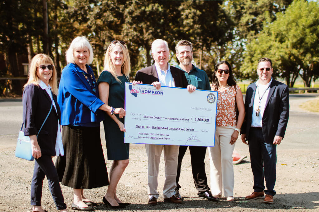 From left: Sonoma Mayor Sandra Lowe, 1st District Supervisor Susan Gorin, Sonoma County Transportation Authority Executive Director Suzanne Smith, Rep. Mike Thompson and other local dignitaries with the $1.5 million check for a roundabout at Eigth Street East and Highway 121 on Aug. 31, 2023. (Aimee Chavez/Aimee’s Gallery)