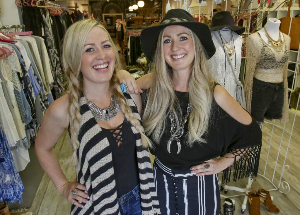 Cristina Wilson Hudlin, left, and Michelle Wilson Bien twin sisters and native Petalumans that founded Ooh La Loft, a Petaluma-based clothing store that's since expanded to Santa Rosa in their store in Petaluma on Monday, April 11, 2016. SCOTT MANCHESTER/ARGUS-COURIER STAFF
