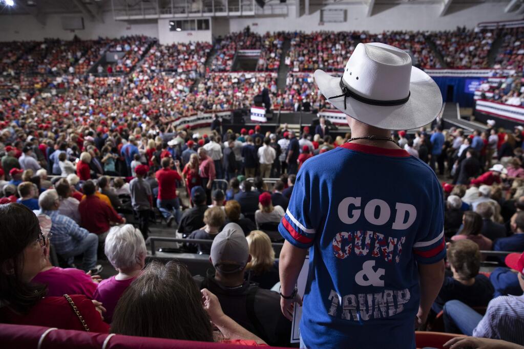Supporters of President Donald Trump listen as he speaks during a campaign rally at the Monroe Civic Center, Wednesday, Nov. 6, 2019, in Monroe, La. (AP Photo/ Evan Vucci)
